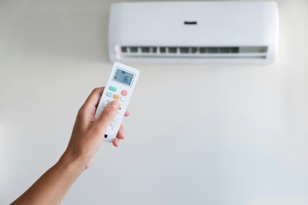 Cool air conditioner with remote control female hand, abnormal heat, heat rescue
